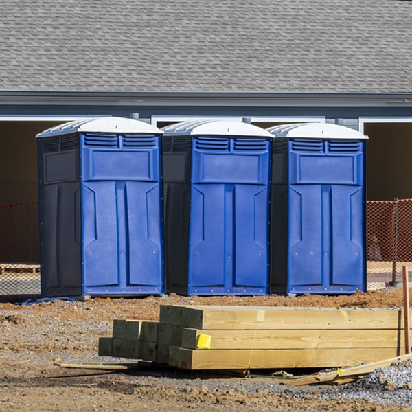 what is the cost difference between standard and deluxe portable toilet rentals in Spring Grove